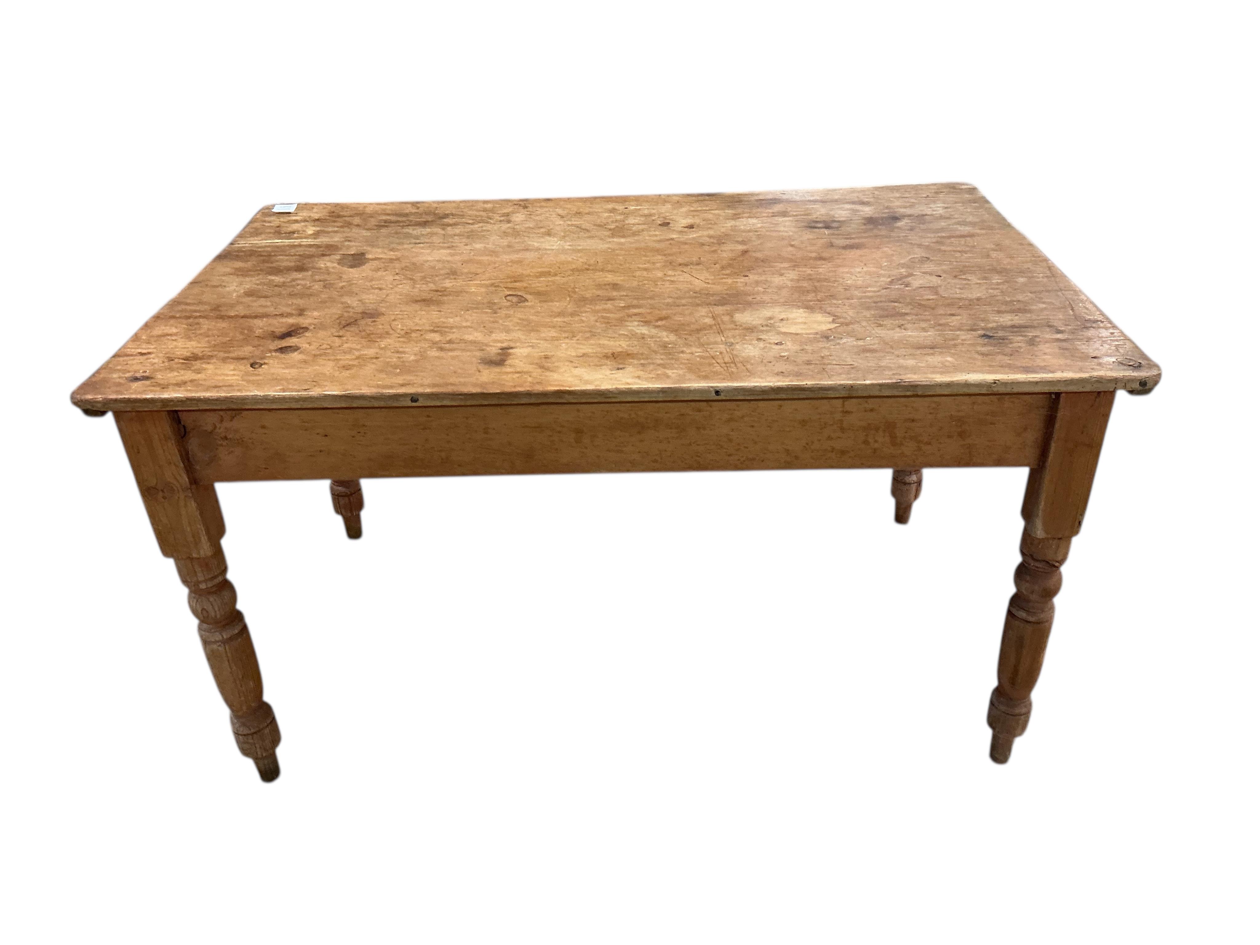 A Victorian rectangular pine kitchen table, width 133cm, depth 82cm, height 72cm together with four Victorian Windsor elm and beech comb back kitchen chairs